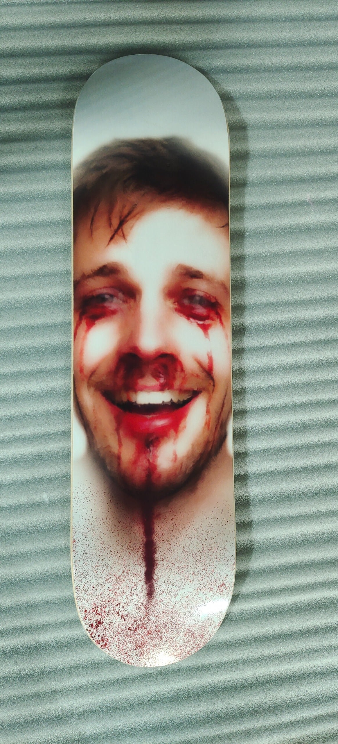‘Smile if you’re trying’ skateboard deck